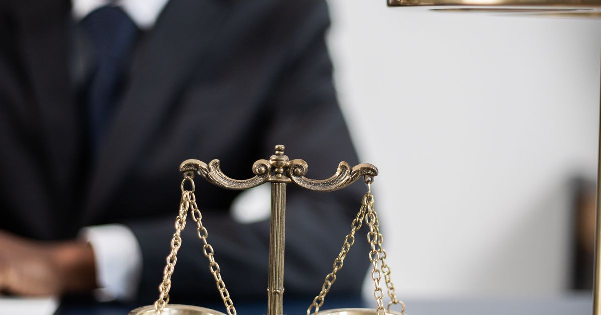 A brass balance scale on a dark table, representing honestly weighing whether the Destiny Matrix is accurate