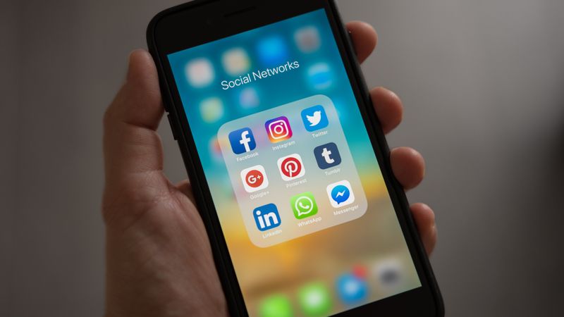 Thumb tapping a smartphone touchscreen