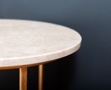 Round table against black wall