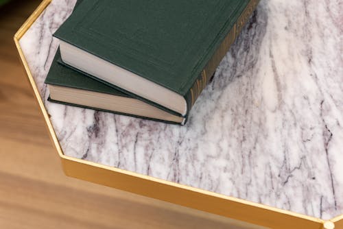 Free Old books placed on marble table Stock Photo