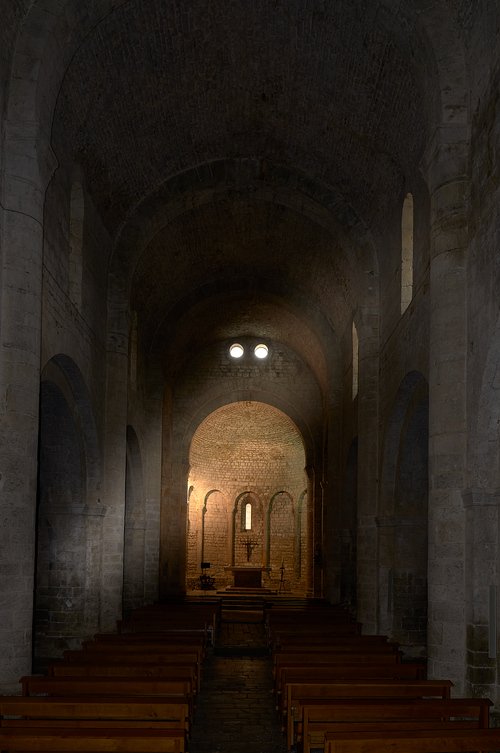 Free Explore the serene beauty of a Romanesque church interior in Porqueras, Catalonia. Stock Photo