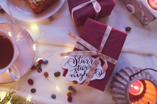 Free A Gift beside a Candle Stock Photo