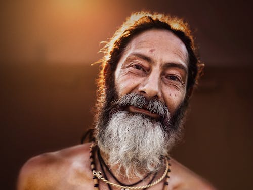 Close-Up Shot of an Elderly Bearded Man Smiling