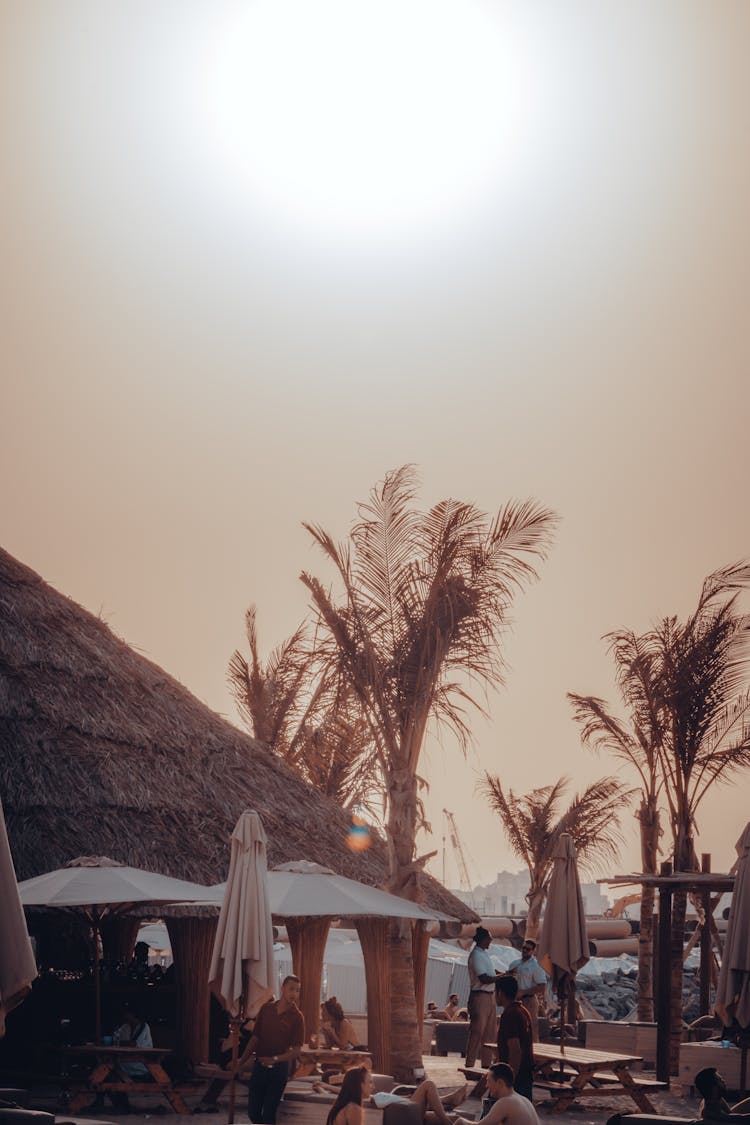 People Spending Time On Terrace On Beach