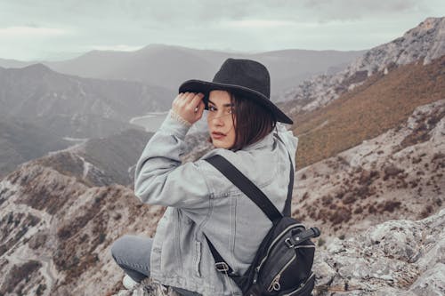Traveling woman on mountain peak