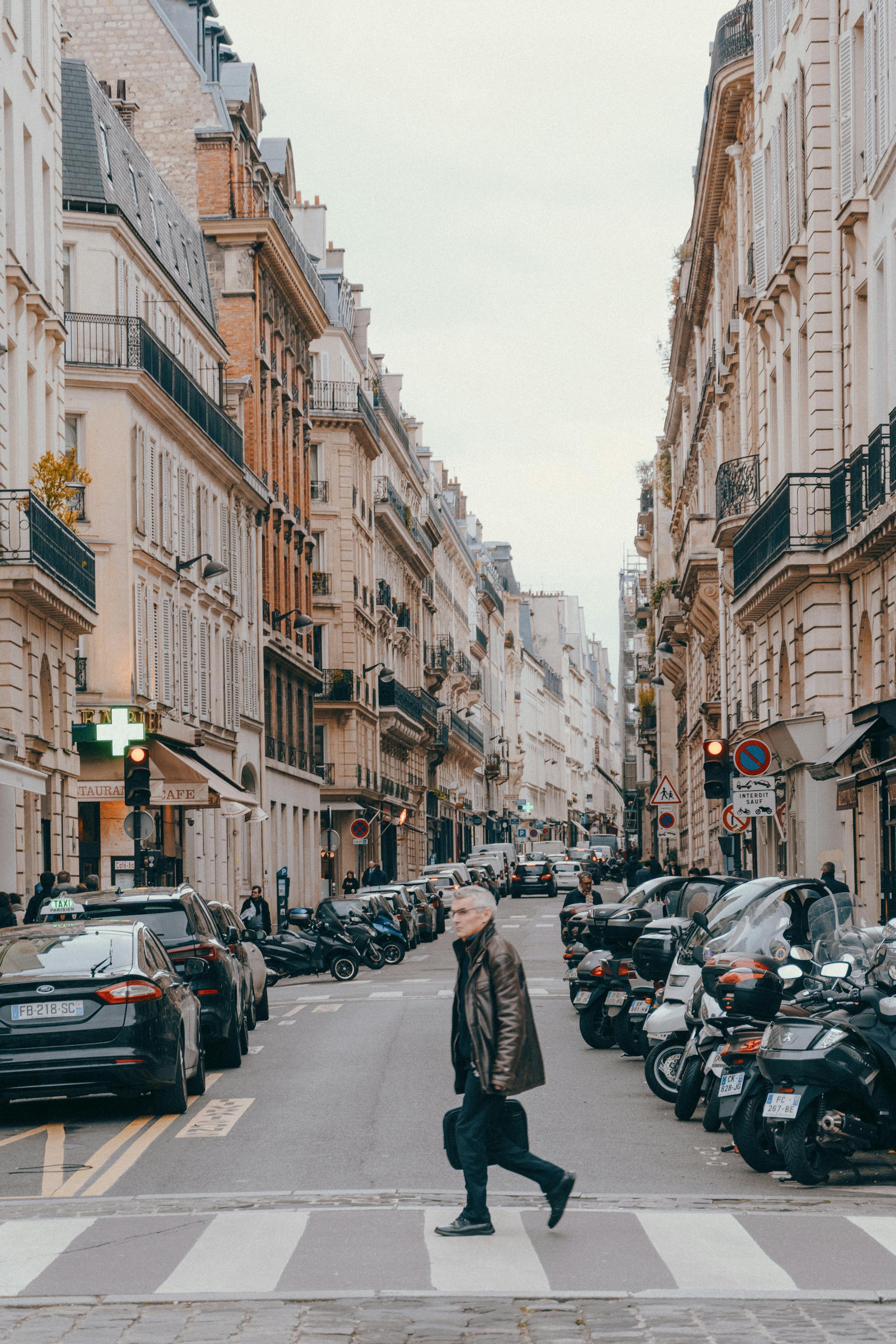 Old man walking near board with posters on street · Free Stock Photo