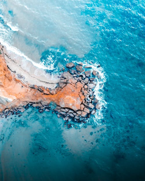 Drone Shot of Rocks Near a Blue Sea