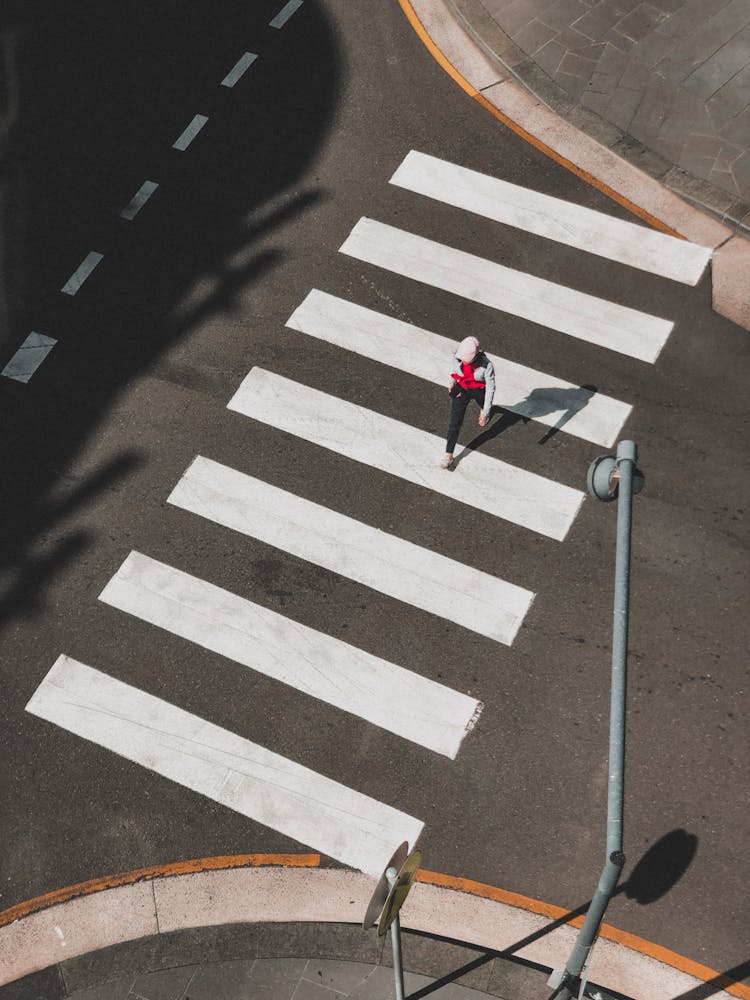 Aerial Shot Of A Person Crossing A Road