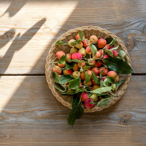 Overhead Shot of Crab Apples in a Woven Basket
