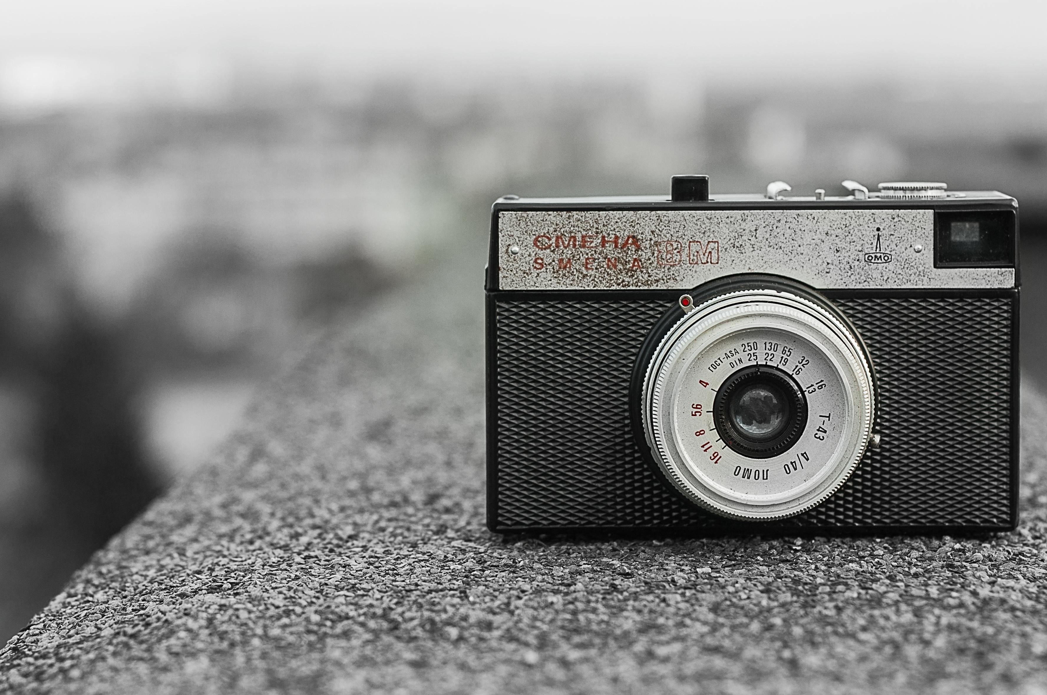 Black and Gray Classic Camera on Gray Concrete · Free Stock Photo