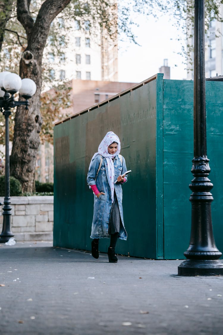 Muslim Woman Walking In Pedestrian Zone