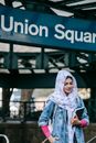 Muslim woman near subway station