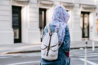 Anonymous woman in headscarf on street