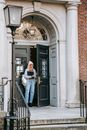 Young student leaving old university building