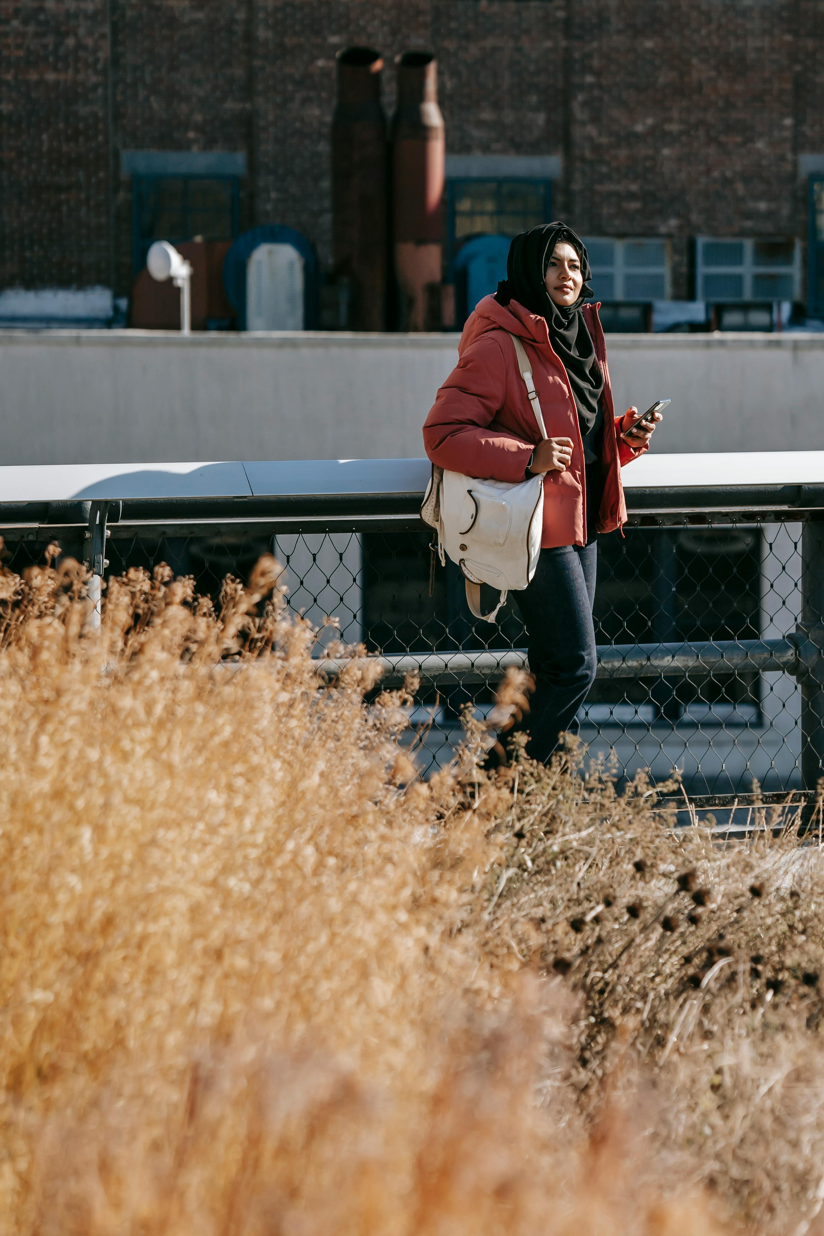 young ethnic woman on street in city