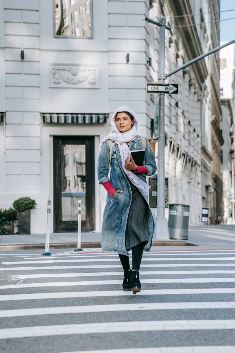 Woman In Headscarf Walking On Crosswalk