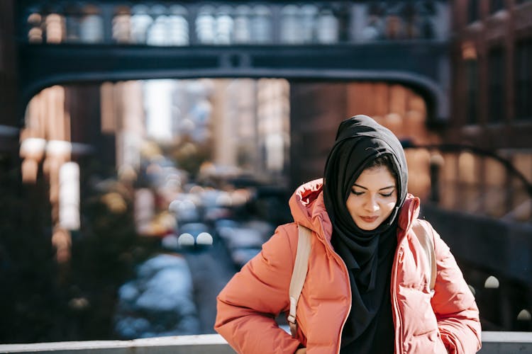 Ethnic Female Standing In City Street