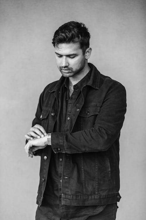 Grayscale Photo of a Man in Black Long Sleeves