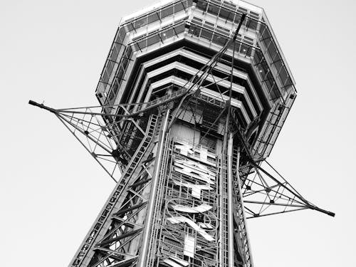 From below black and white of tall Tsutenkaku tower located in Osaka in Japan