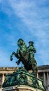 Statue of Man Riding Horse Under Blue Sky