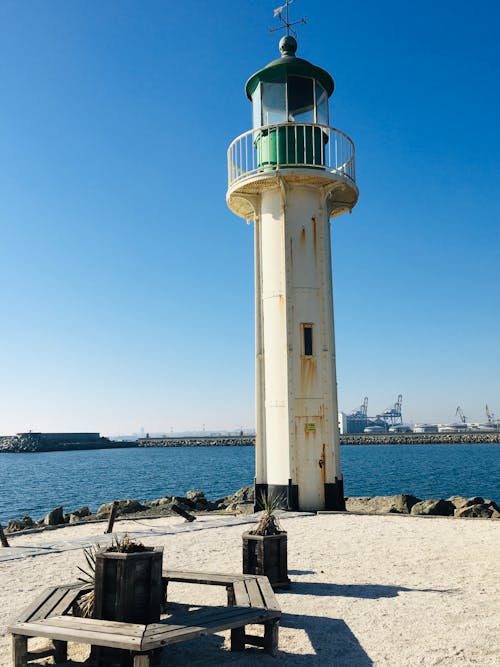 A White Lighthouse near the Beach