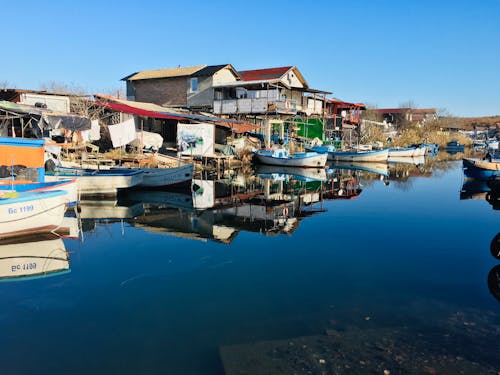 Boats Docked on River Side 