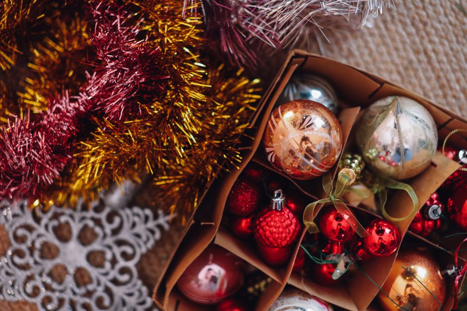 paw print christmas ornaments - A collection of festive Christmas ornaments and tinsel, perfect for holiday decor inspiration.