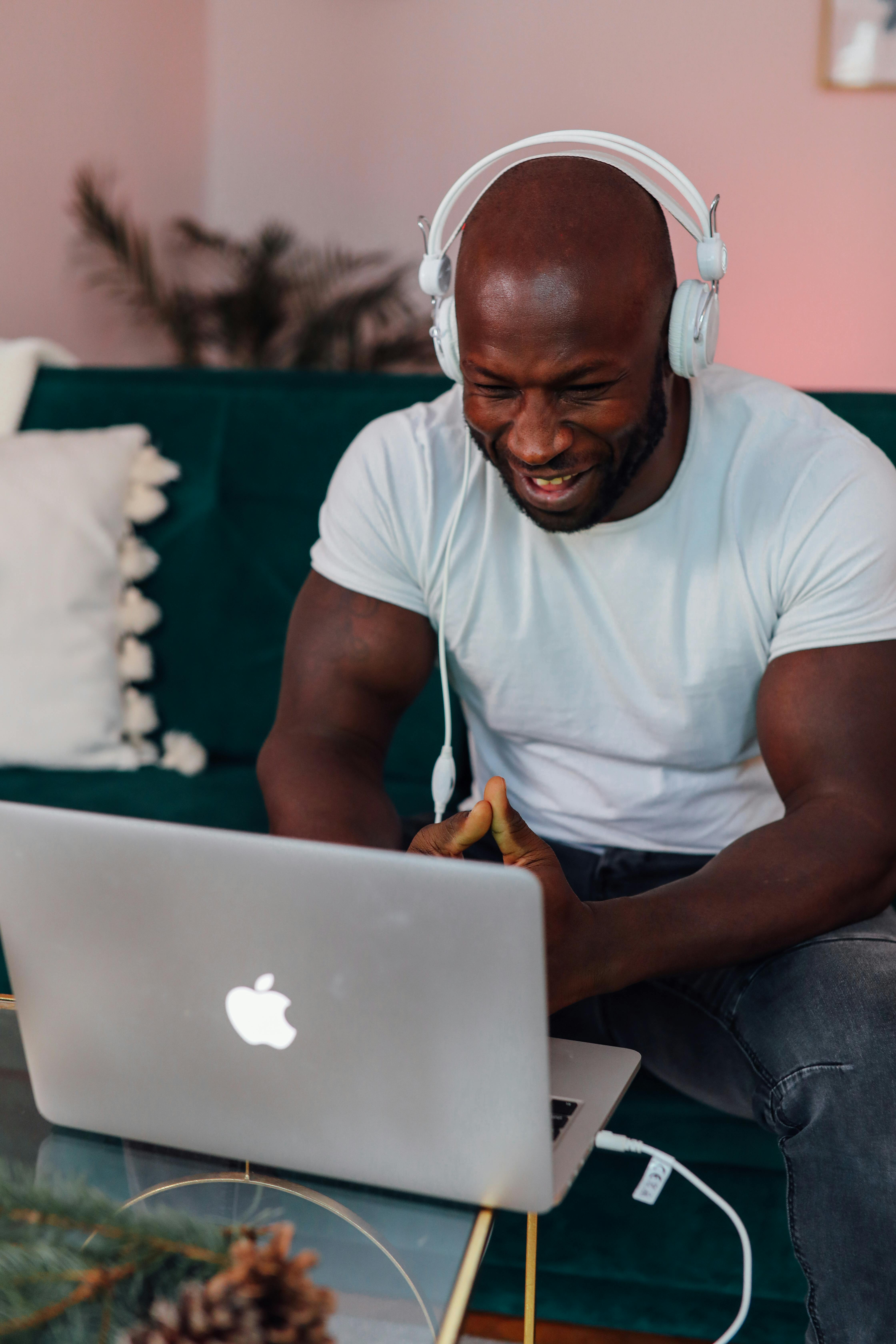 man in white crew neck t shirt on video call