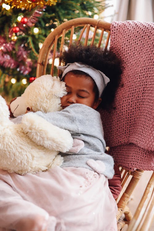 Girl In Gray Sleeping On A Chair