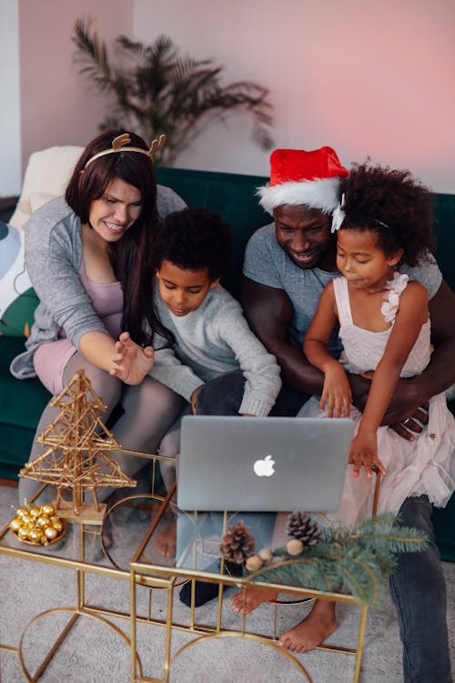 Free Family Looking At Laptop Stock Photo