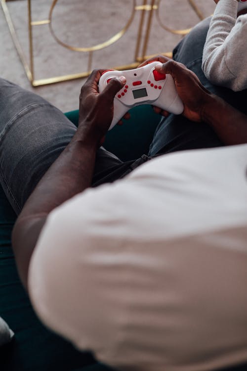 A Man Holding a Game Console