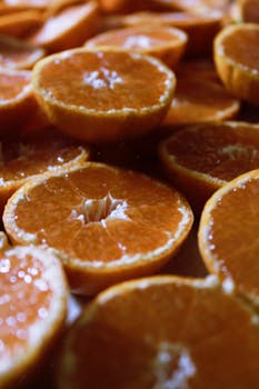 Vibrant close-up of freshly sliced oranges, showcasing juicy textures.