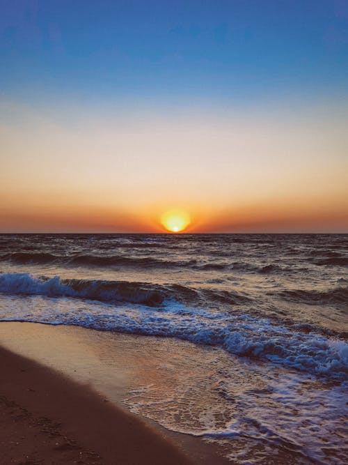 Waves on Sea Shore at Sunset