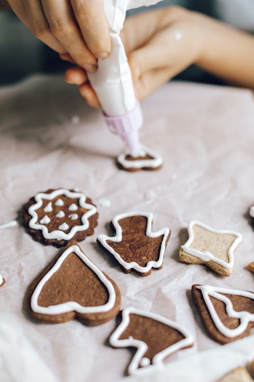 A Person Decorating Sugar Cookies