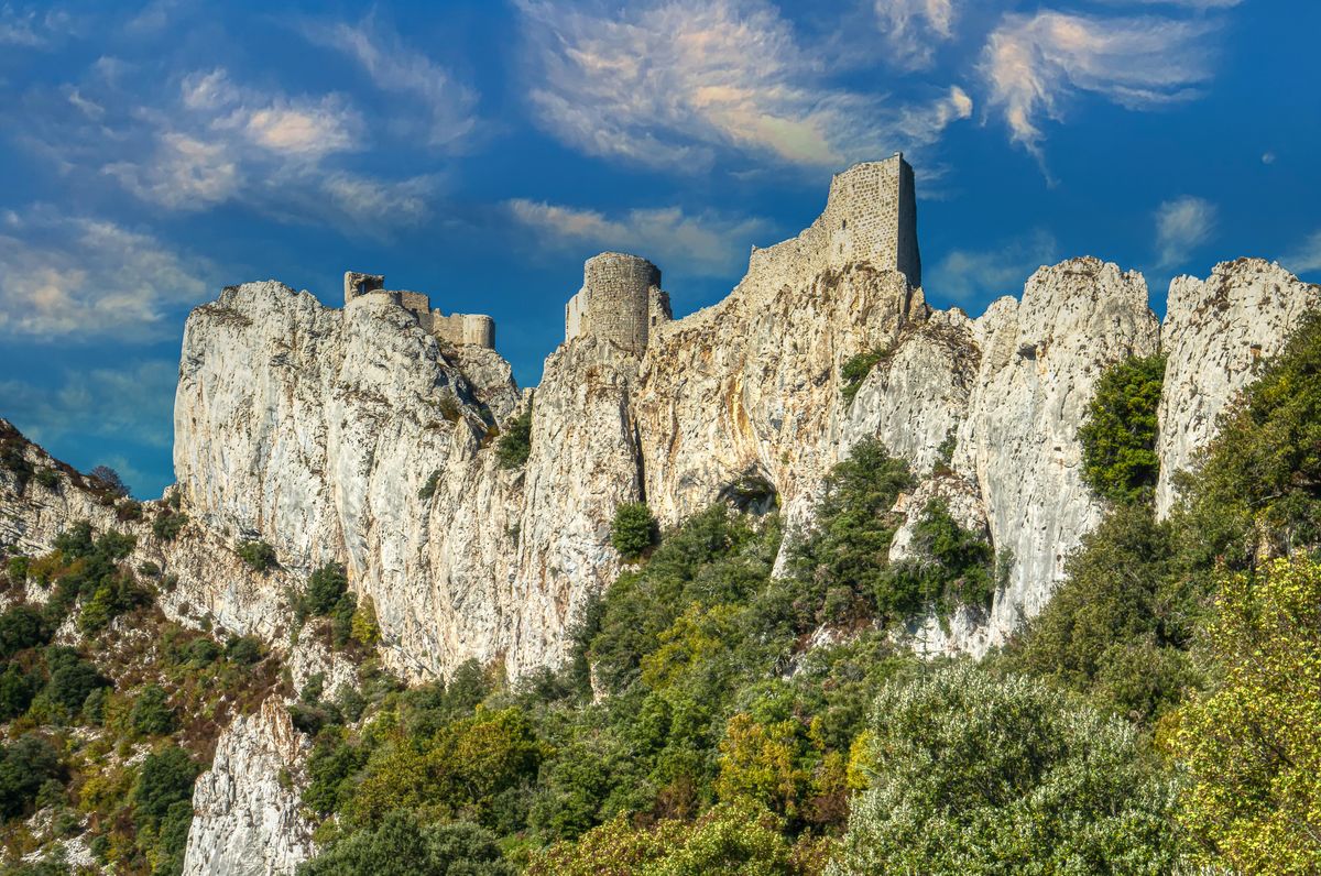 The Cathar castle of Peyrepertuse atop white limestone cliffs