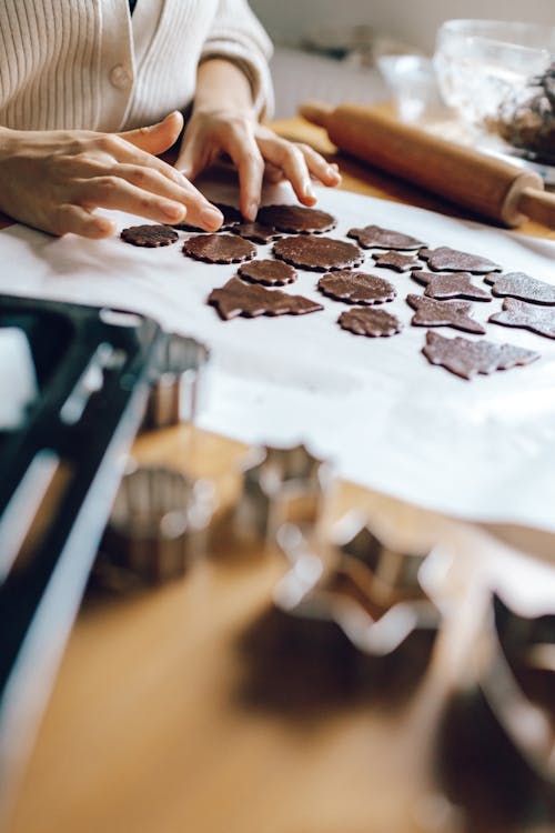 Fingers Touching Brown Flower Shaped Dough