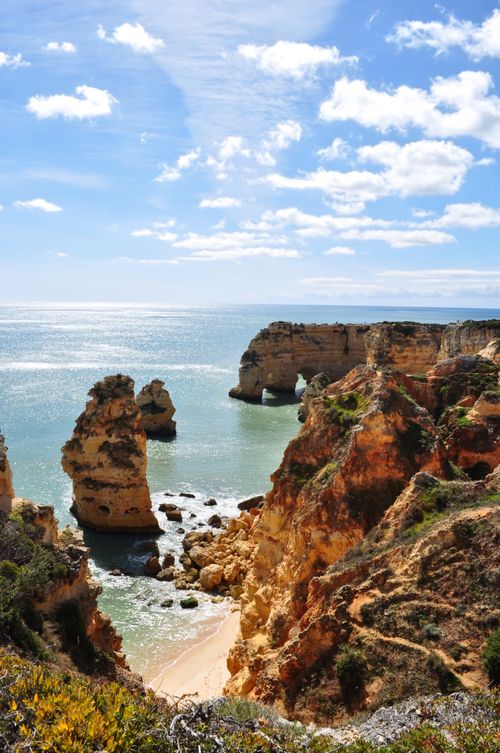 Free Stunning rock formations along Algarve's coastline under a clear blue sky. Stock Photo