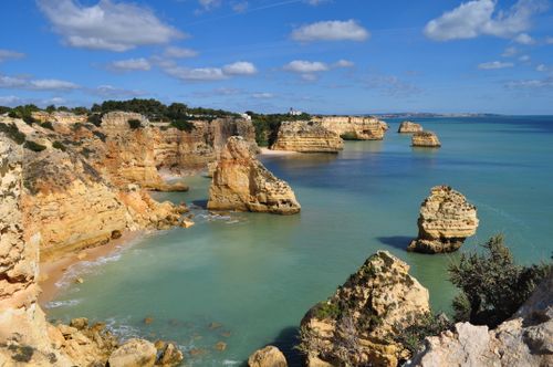 Free Breathtaking view of Marinha Beach cliffs and turquoise waters in Algarve, Portugal. Stock Photo