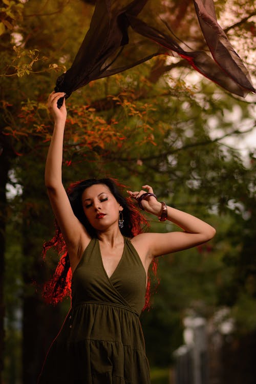 Woman with Long Hair Tossing Up Black Tulle Scarf 