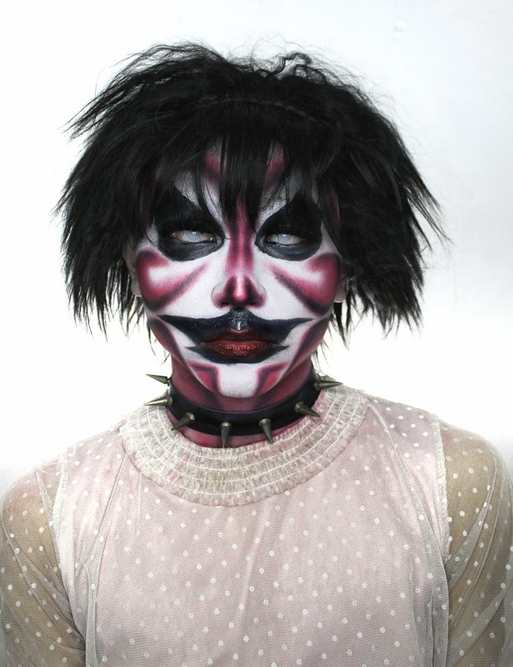 Unrecognizable Person Wearing Demonic Mask