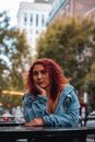 Red Head Woman in Blue Denim Jacket Showing Cleavage