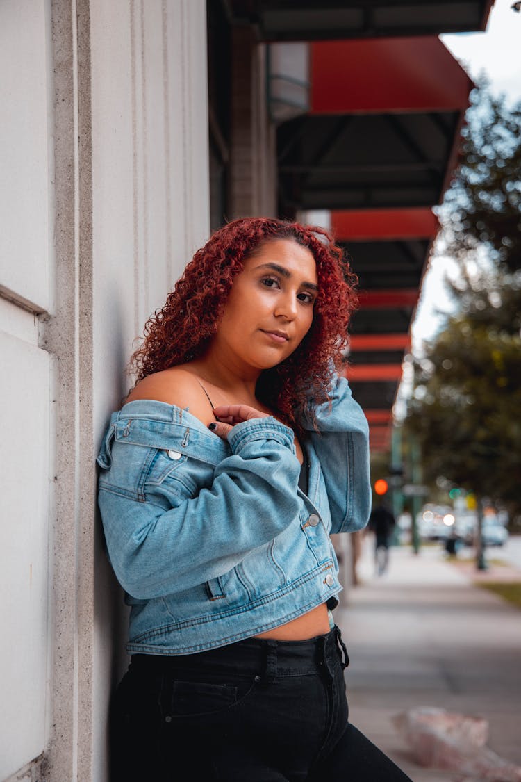 Red Head Woman In Blue Denim Jacket Showing Shoulder