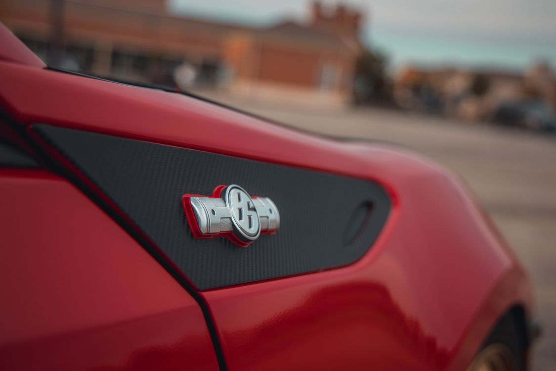 Close-up of a Badge on the Back of a Car · Free Stock Photo