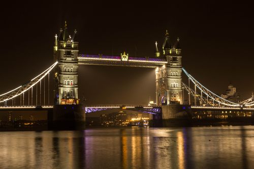 Free Illuminated Tower Bridge over the River Thames at night in London. Stock Photo