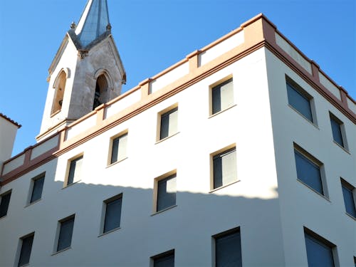 White Concrete Building Under Blue Sky