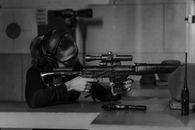 A Woman Holding a Rifle