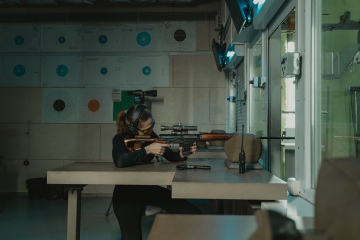 Experienced shooter training with a rifle