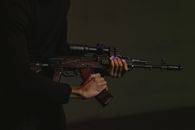 Man in Black Long Sleeve Shirt Holding Black Rifle