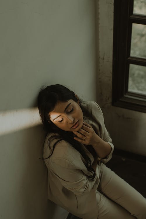 Free Tired Indian woman with eyes closed Stock Photo