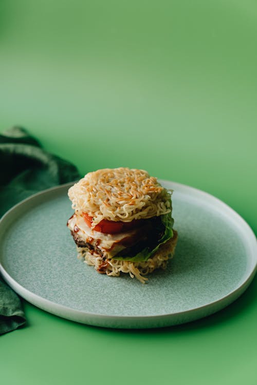 Free Delicious Ramen Burger on Ceramic Plate Stock Photo